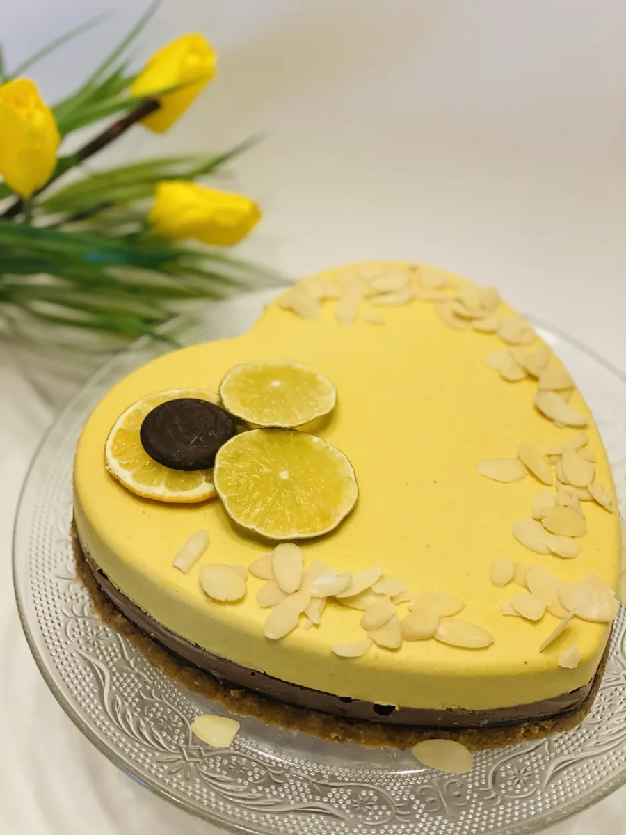 The first raw vegan cake Olga sold in 2021 — a heart-shaped lemon and chocolate cake for a child with severe gluten intolerance